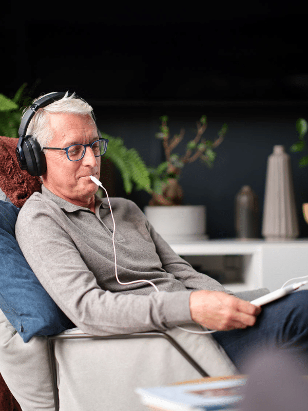 man using the Lenire Tinnitus Treatment Device